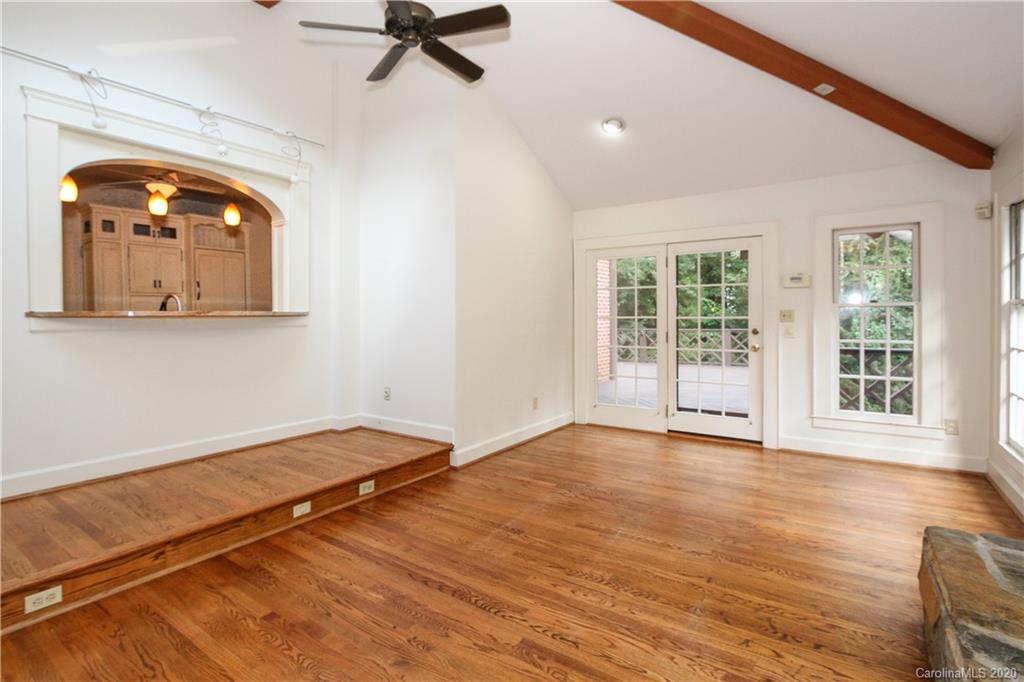 2120 Malvern Road Charlotte, NC 28207 - Photo 15 of 46 a view of an empty room with wooden floor and a window