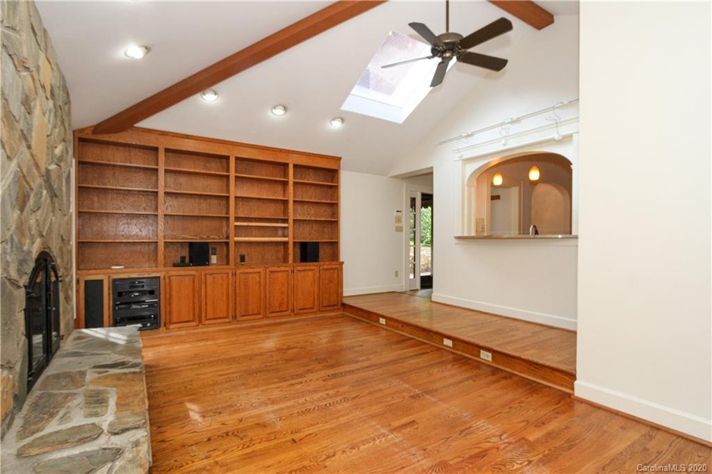 2120 Malvern Road Charlotte, NC 28207 - Photo 16 of 46 a view of a livingroom with a furniture and a ceiling fan
