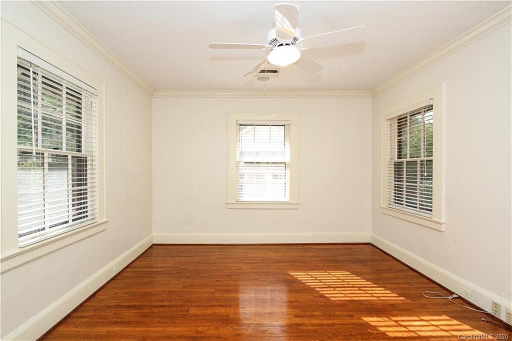 2120 Malvern Road Charlotte, NC 28207 - Photo 23 of 46 a view of an empty room with a window and wooden floor