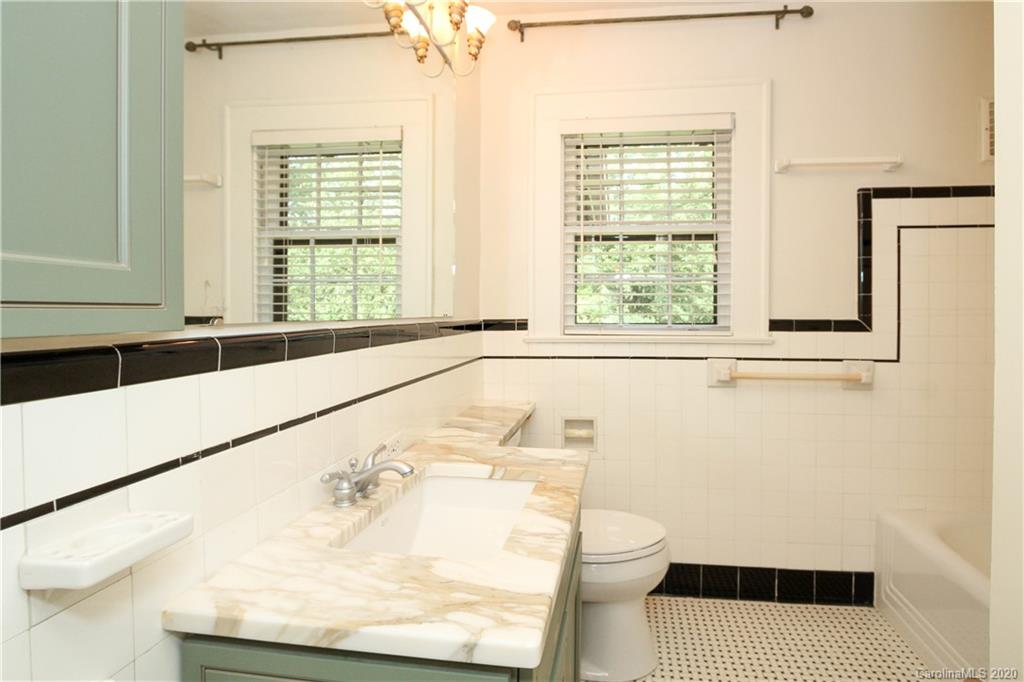 2120 Malvern Road Charlotte, NC 28207 - Photo 25 of 46 a bathroom with a bathtub and a window