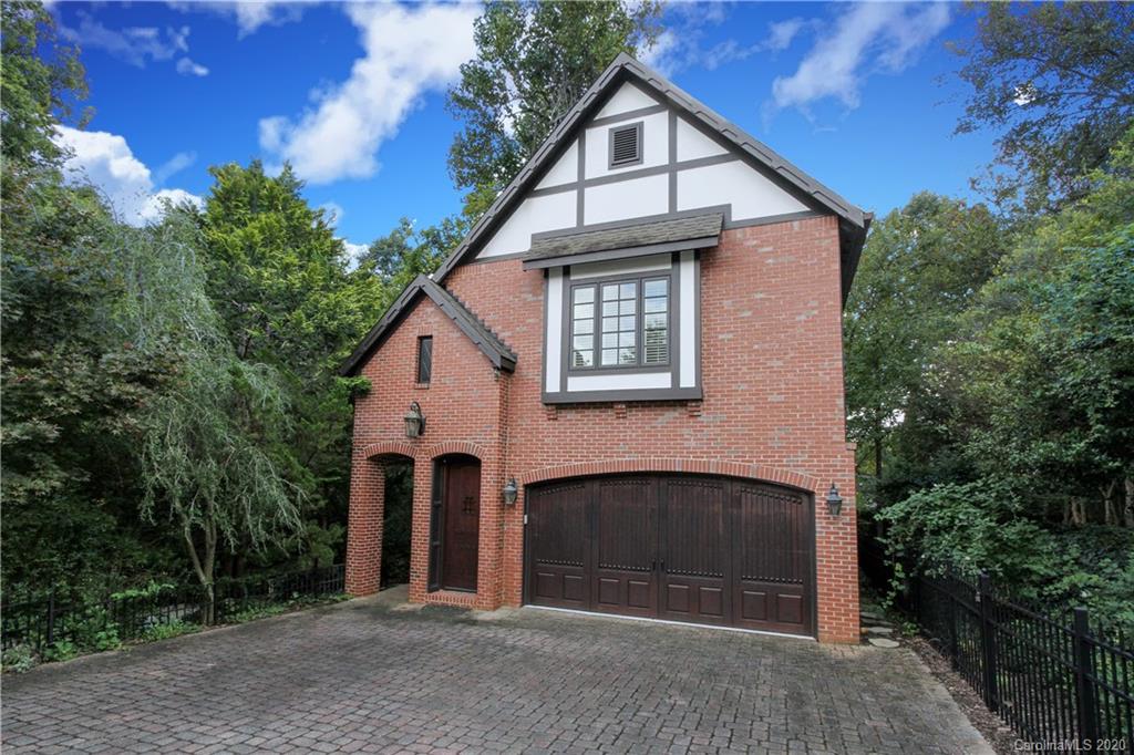 2120 Malvern Road Charlotte, NC 28207 - Photo 26 of 46 a front view of a house with a yard and garage