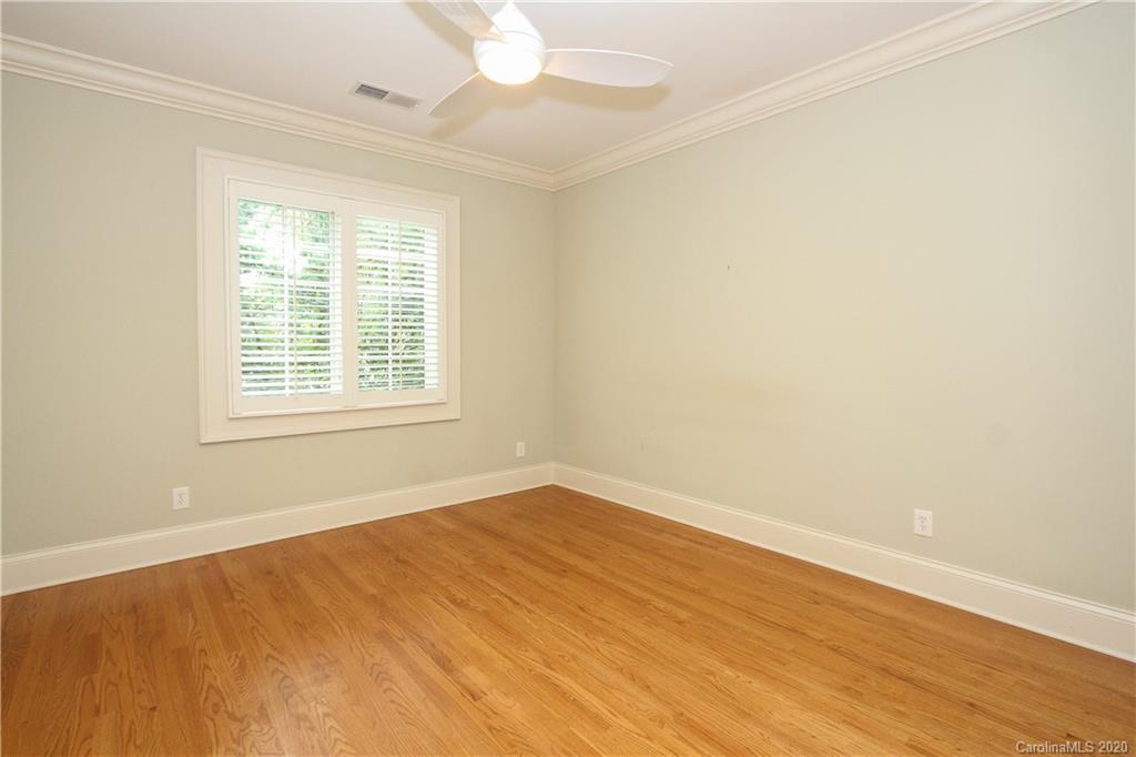 2120 Malvern Road Charlotte, NC 28207 - Photo 31 of 46 an empty room with wooden floor and windows