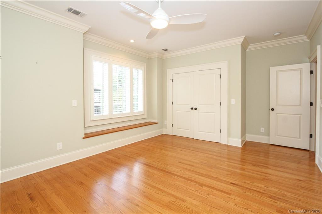 2120 Malvern Road Charlotte, NC 28207 - Photo 32 of 46 an empty room with wooden floor and windows