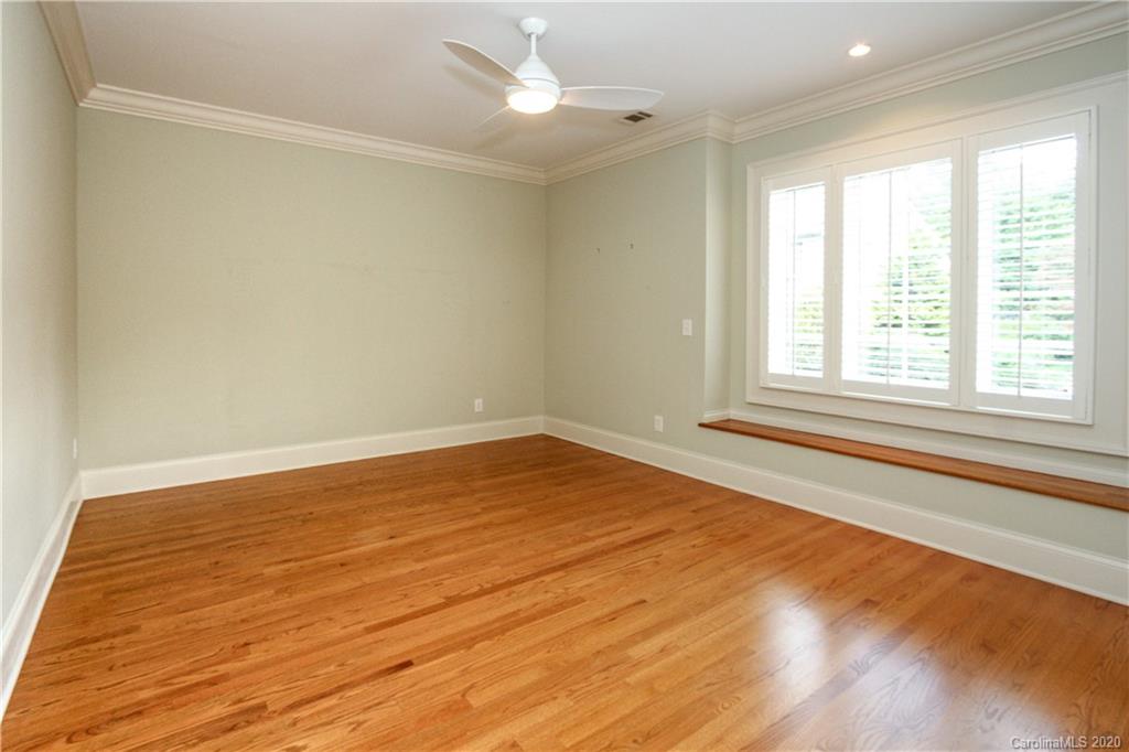 2120 Malvern Road Charlotte, NC 28207 - Photo 33 of 46 an empty room with wooden floor and windows