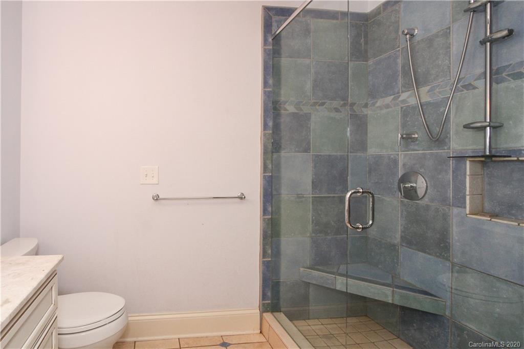 2120 Malvern Road Charlotte, NC 28207 - Photo 35 of 46 a bathroom with a granite countertop bathtub shower and toilet