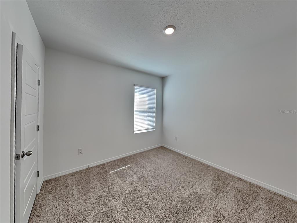 3515 Nettle Loop Tavares, FL 32778 - Photo 11 of 19 a view of an empty room with a window