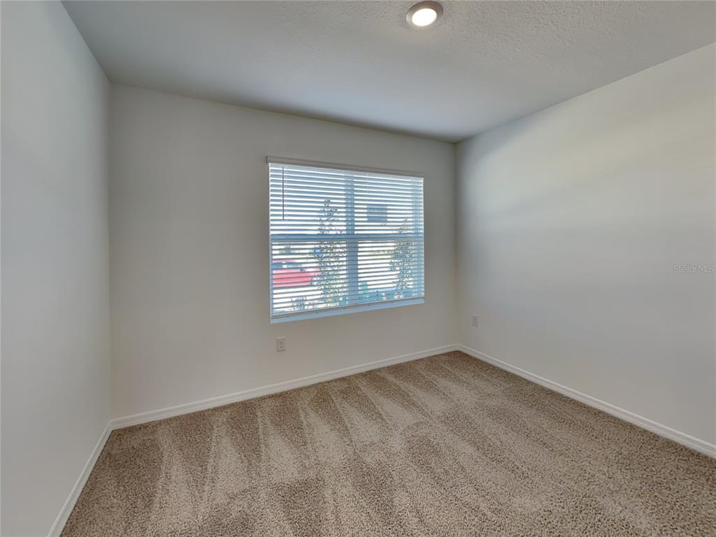 3515 Nettle Loop Tavares, FL 32778 - Photo 12 of 19 an empty room with windows