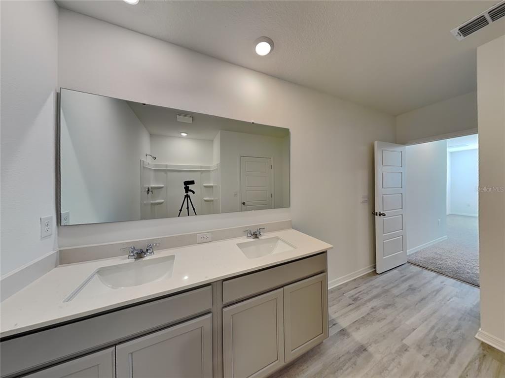 3515 Nettle Loop Tavares, FL 32778 - Photo 15 of 19 a bathroom with a sink and a mirror
