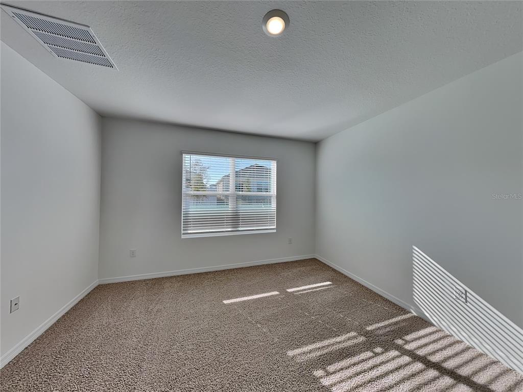 3515 Nettle Loop Tavares, FL 32778 - Photo 16 of 19 an empty room with a empty space and window