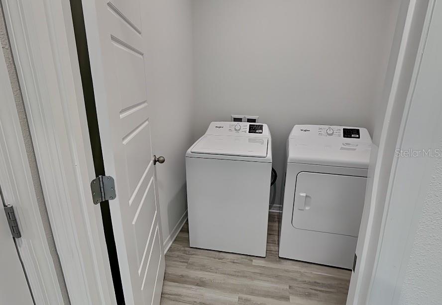 3515 Nettle Loop Tavares, FL 32778 - Photo 17 of 19 a utility room with dryer and washer