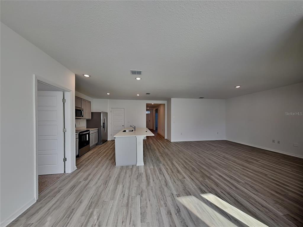 3515 Nettle Loop Tavares, FL 32778 - Photo 3 of 19 a view of kitchen with a table and chairs