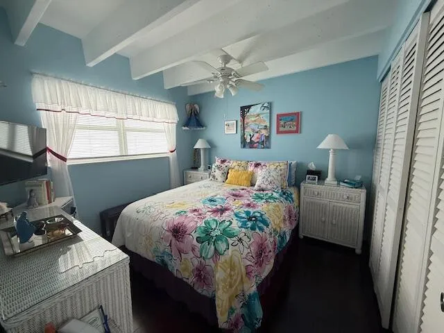 a bedroom with bed and window