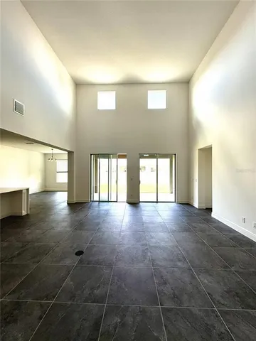 a view of empty room with windows