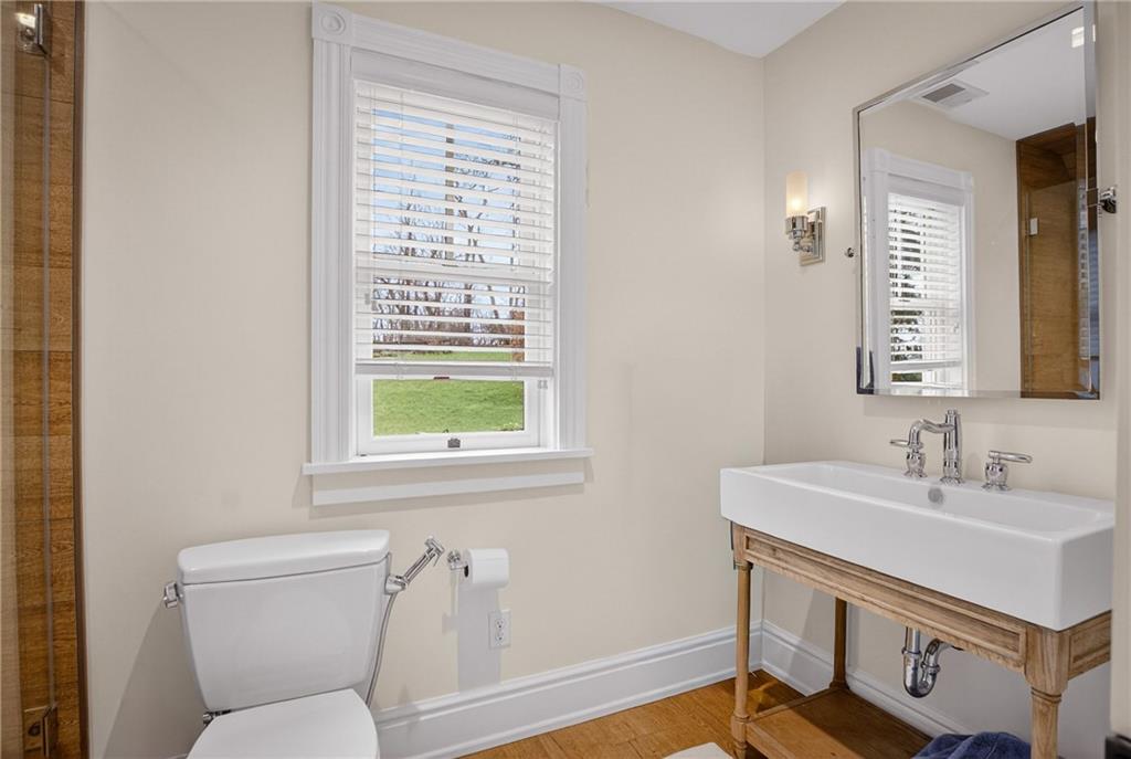 321 Fairview Road Pittsburgh, PA 15238 - Photo 34 of 50 a bathroom with a sink a toilet a mirror and a window