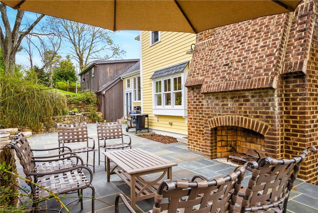 321 Fairview Road Pittsburgh, PA 15238 - Photo 43 of 50 a view of a patio with a table and chairs and potted plants