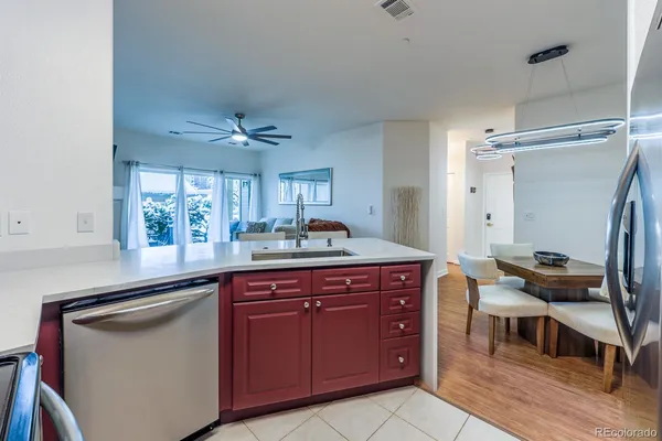 a kitchen with cabinets a sink and appliances