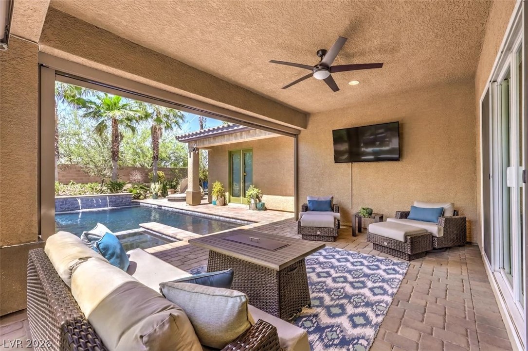 7119 Arabian Ridge Street Las Vegas, NV 89131 - Photo 52 of 73 An inviting outdoor lounge area features an in-ground pool and ample space for relaxation.
