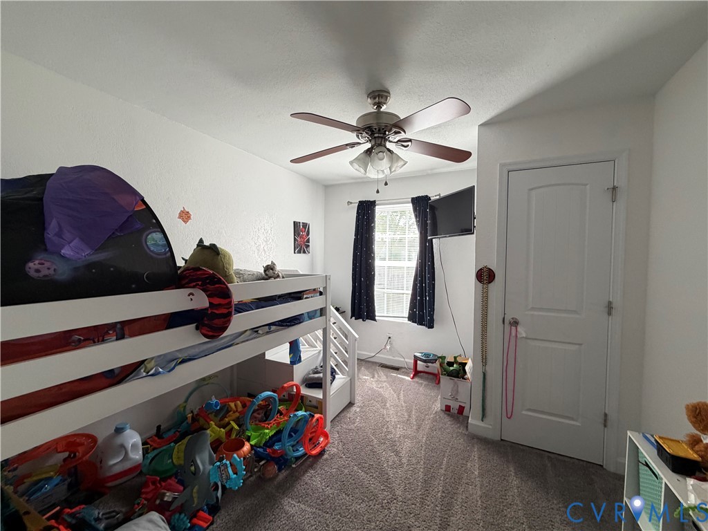 1124 Myrtle Street Suffolk, VA 23434 - Photo 8 of 15 Carpeted room with a ceiling fan light fixture, wh