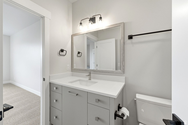 496 North Farmhouse Way, Unit 11 Midway, UT 84049 - Photo 41 of 50 Bathroom featuring a single vanity with light gray cabinetry, white countertop, and contemporary brushed nickel faucet