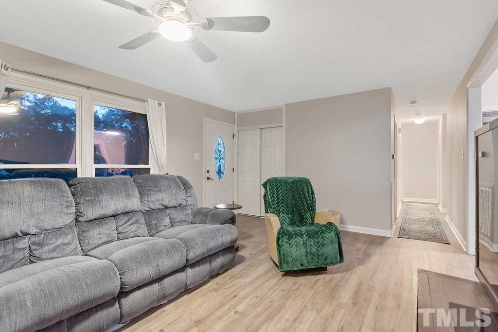 2613 Elmhurst Circle Raleigh, NC 27610 - Photo 11 of 29 a living room with furniture and a large window
