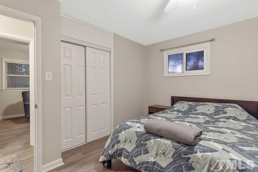 2613 Elmhurst Circle Raleigh, NC 27610 - Photo 20 of 29 a bedroom with a bed and a window
