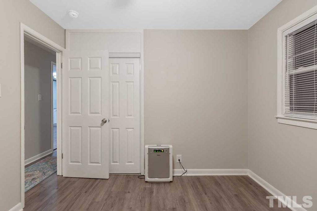 2613 Elmhurst Circle Raleigh, NC 27610 - Photo 25 of 29 a view of an empty room with wooden floor