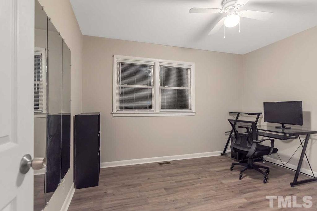 2613 Elmhurst Circle Raleigh, NC 27610 - Photo 26 of 29 a view of a workspace with furniture and a window