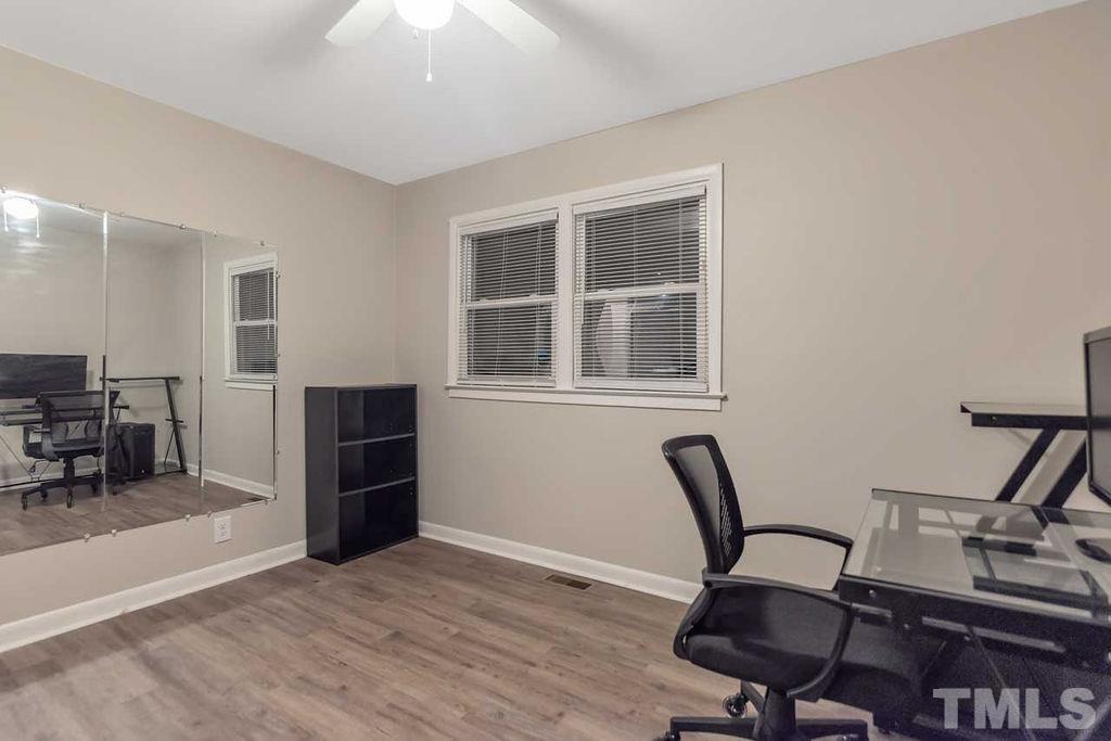 2613 Elmhurst Circle Raleigh, NC 27610 - Photo 27 of 29 a view of a workspace with furniture and a window