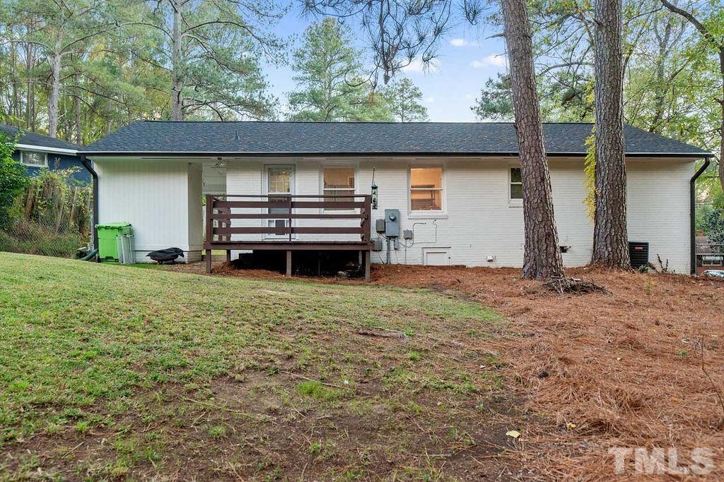 2613 Elmhurst Circle Raleigh, NC 27610 - Photo 6 of 29 a backyard of a house with barbeque oven