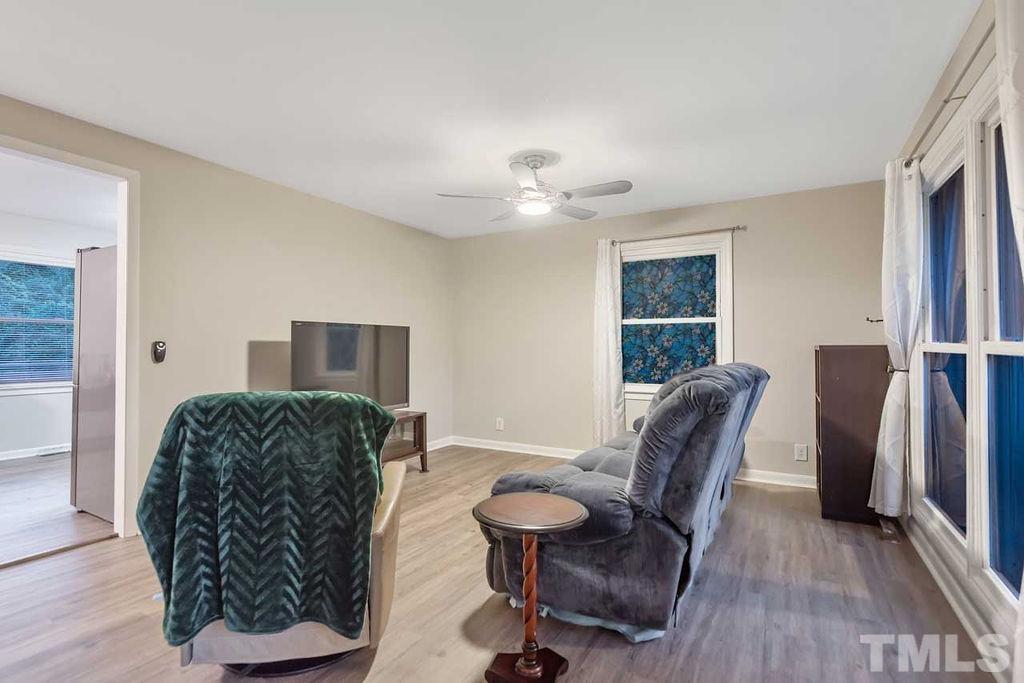 2613 Elmhurst Circle Raleigh, NC 27610 - Photo 8 of 29 a living room with furniture and a window