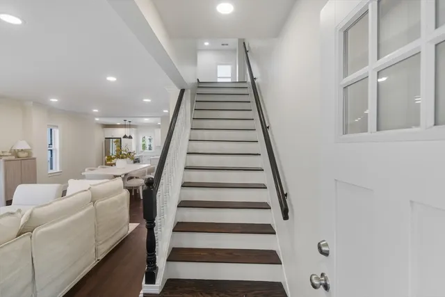 a view of a room with wooden floor a sink and a window
