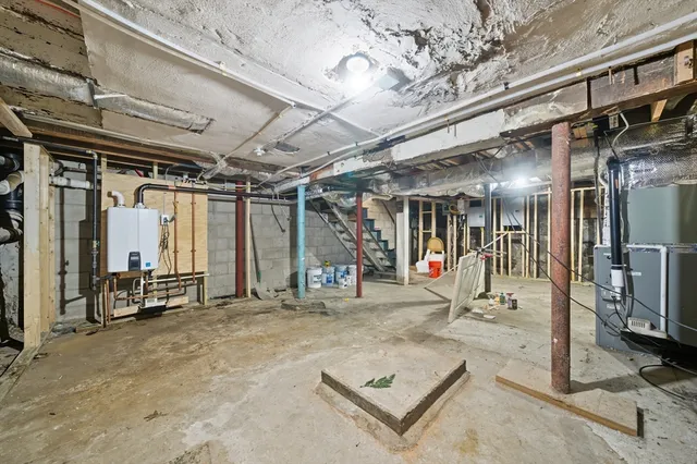 a view of a backyard with a small yard and wooden fence