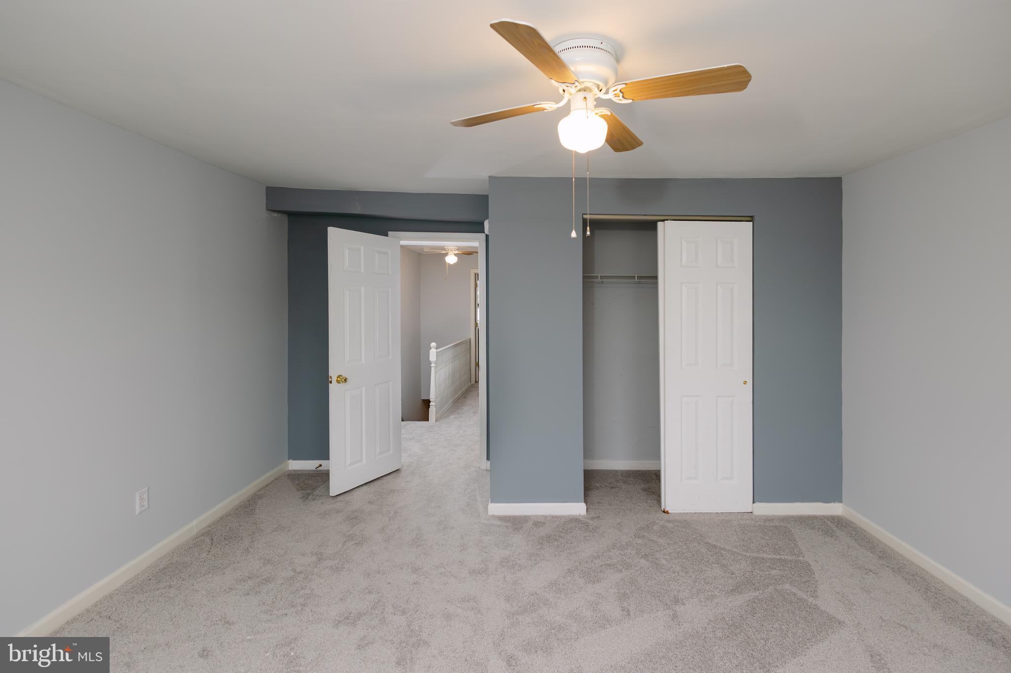 3732 Falls Road Baltimore, MD 21211 - Photo 16 of 46 an empty room with closet and a ceiling fan