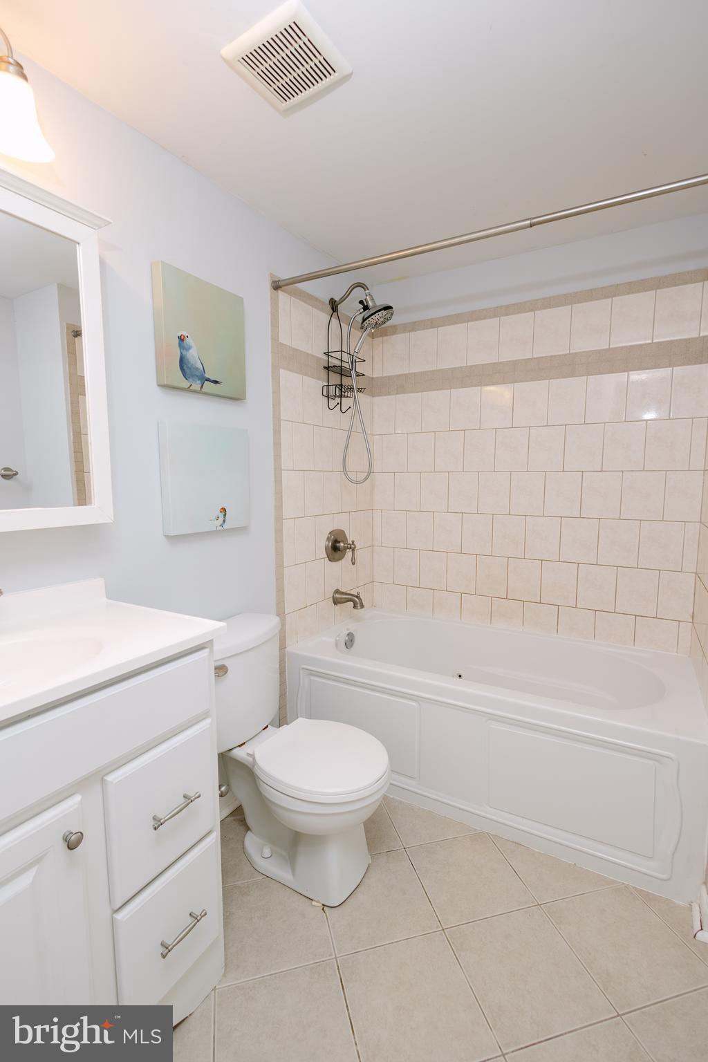 3732 Falls Road Baltimore, MD 21211 - Photo 21 of 46 a bathroom with a granite countertop toilet a sink and bathtub