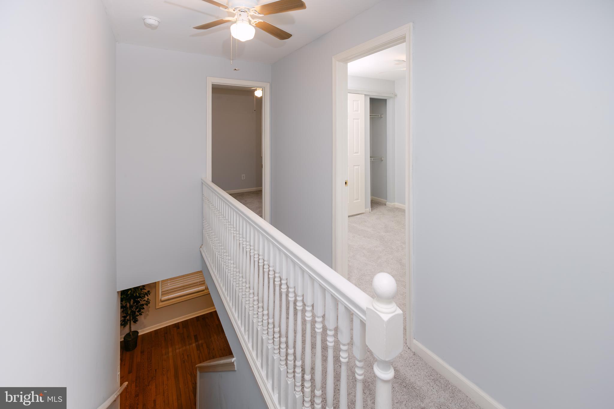 3732 Falls Road Baltimore, MD 21211 - Photo 22 of 46 a view of a hallway with wooden floor and staircase