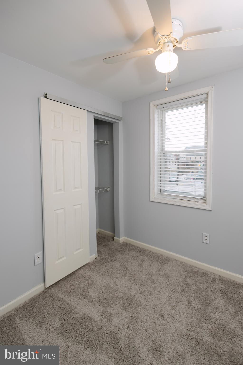 3732 Falls Road Baltimore, MD 21211 - Photo 24 of 46 an empty room with windows and fan