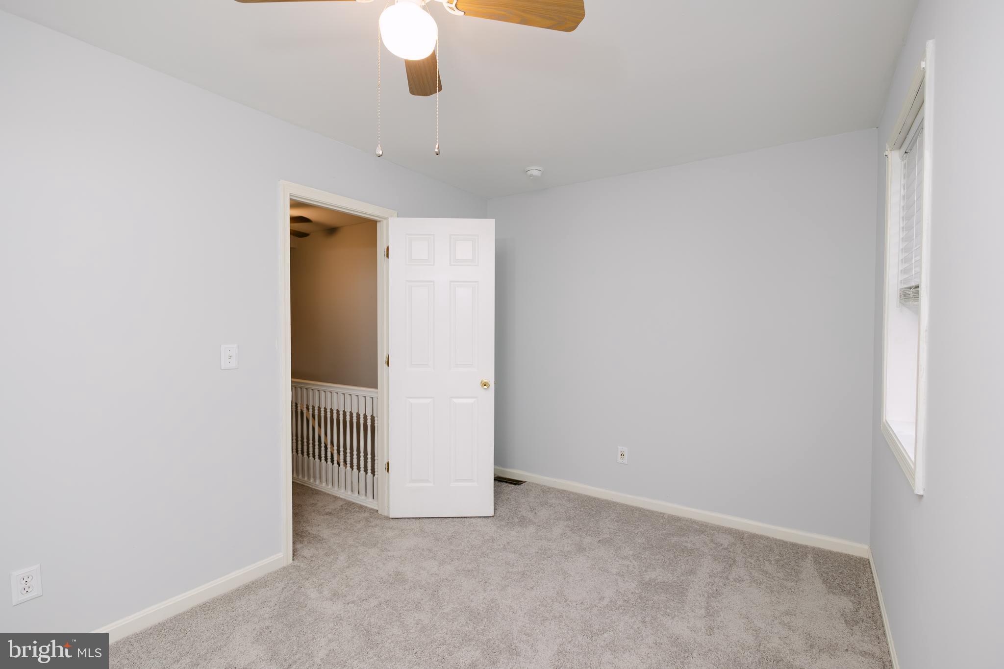 3732 Falls Road Baltimore, MD 21211 - Photo 27 of 46 an empty room with chandelier fan