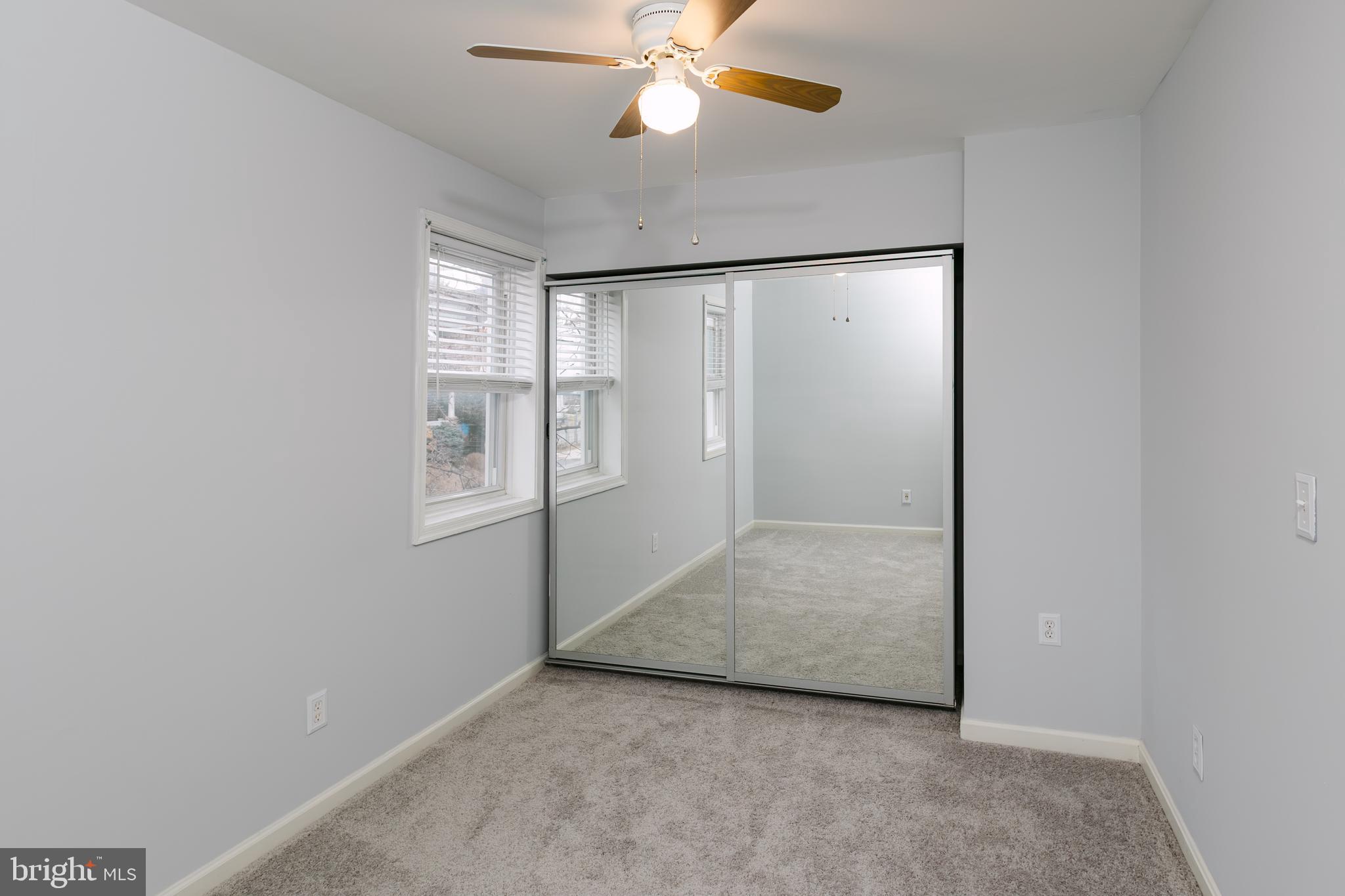 3732 Falls Road Baltimore, MD 21211 - Photo 30 of 46 an empty room with windows and fan