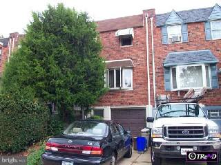 a front view of a house with outdoor space