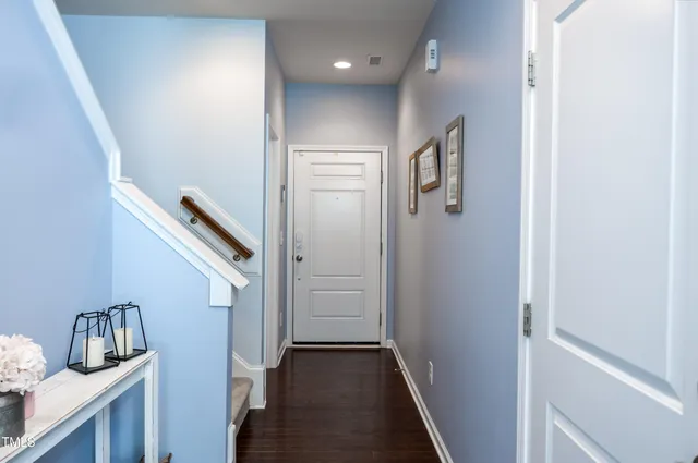 a view of a hallway with front door