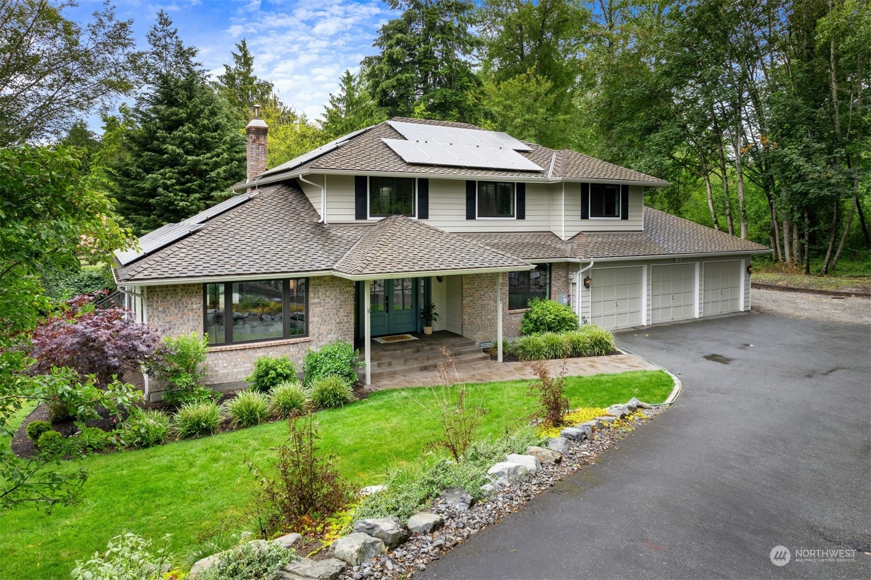 24327 Lockwood Road Bothell, WA 98021 - Photo 1 of 40 a front view of a house with a yard and porch