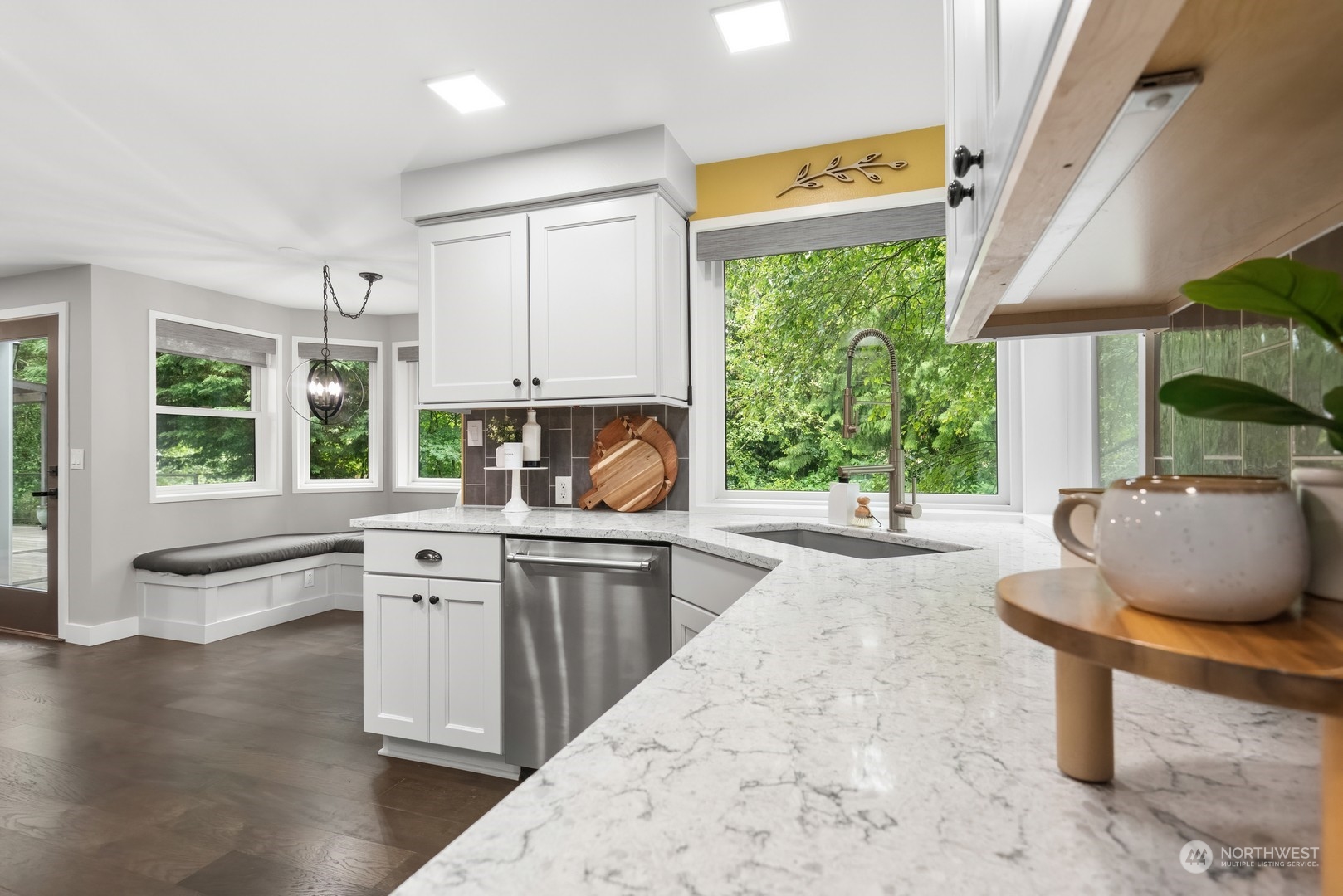 24327 Lockwood Road Bothell, WA 98021 - Photo 11 of 40 a kitchen with stainless steel appliances granite countertop a stove a sink and a microwave