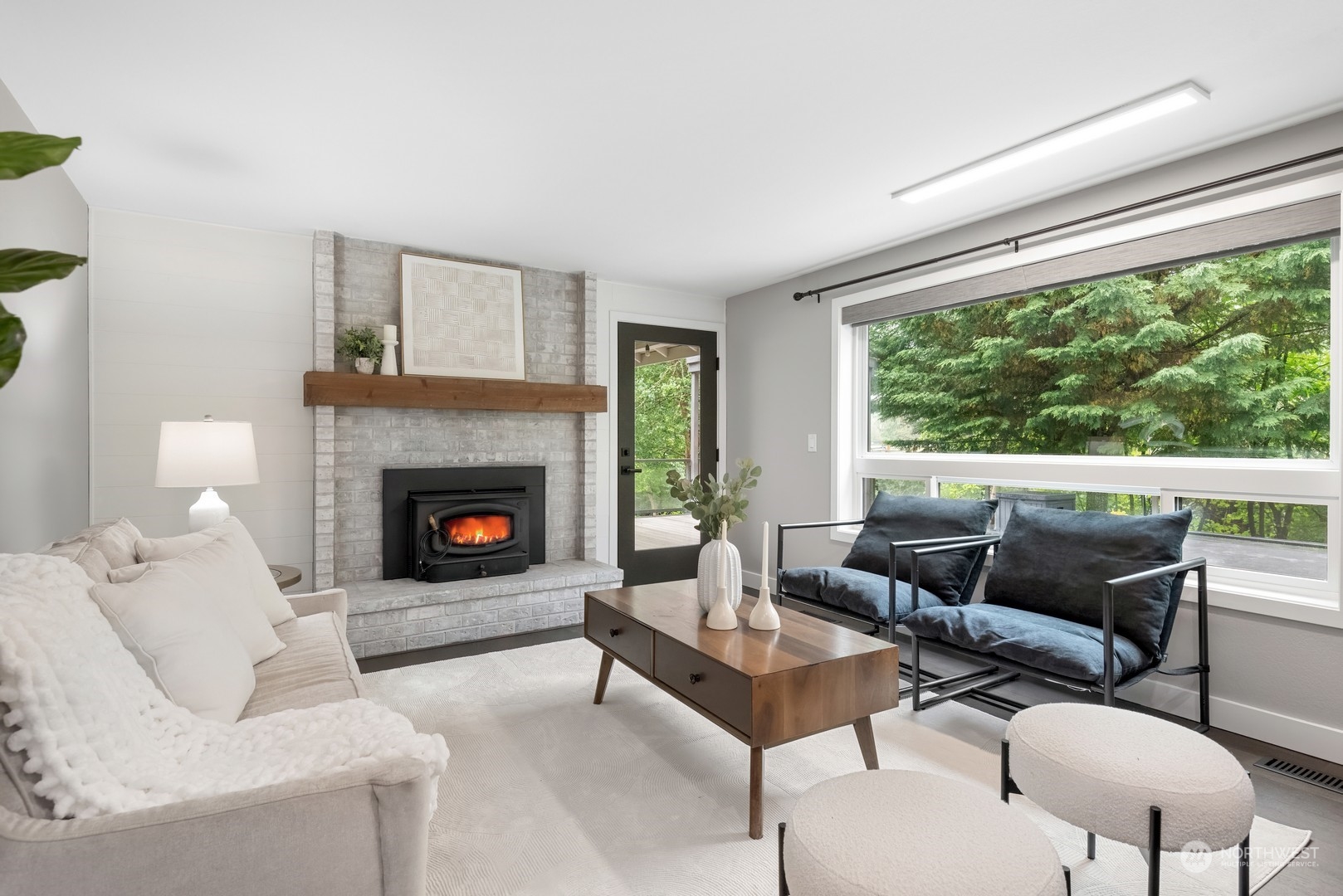 24327 Lockwood Road Bothell, WA 98021 - Photo 15 of 40 a living room with furniture and a fireplace