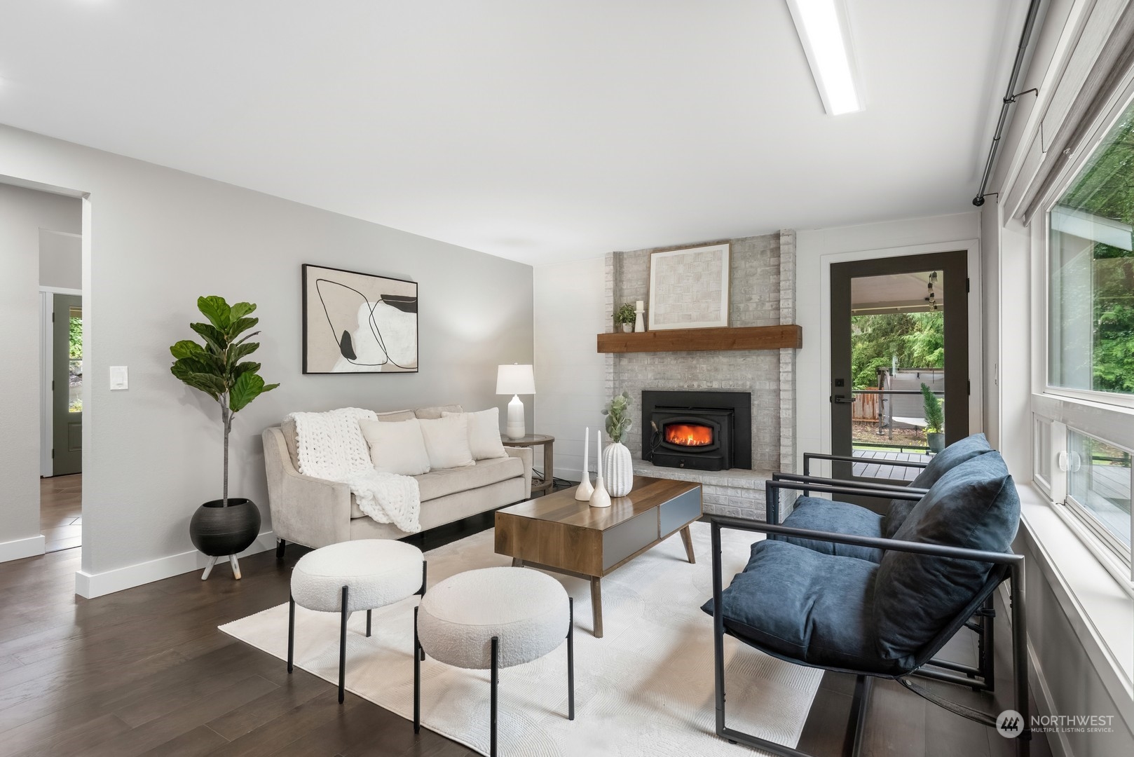 24327 Lockwood Road Bothell, WA 98021 - Photo 16 of 40 a living room with furniture and a fireplace