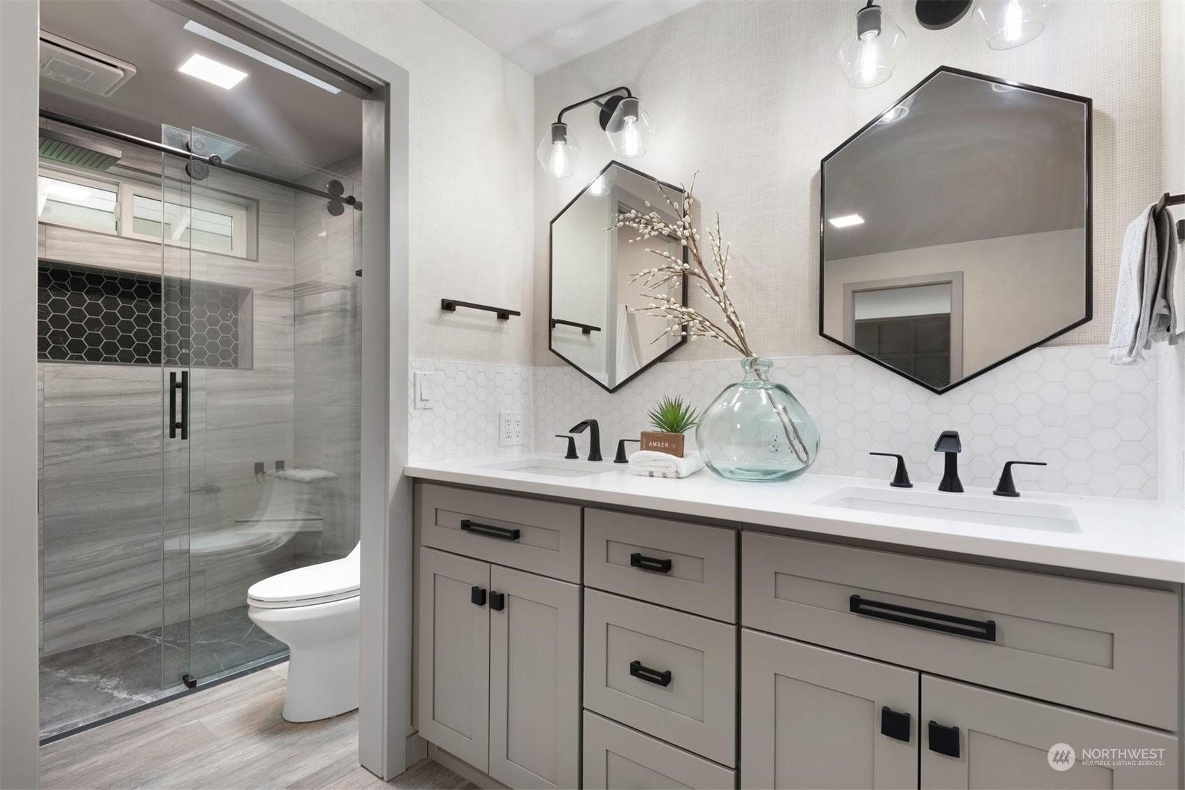 24327 Lockwood Road Bothell, WA 98021 - Photo 19 of 40 a bathroom with a toilet a sink and mirror
