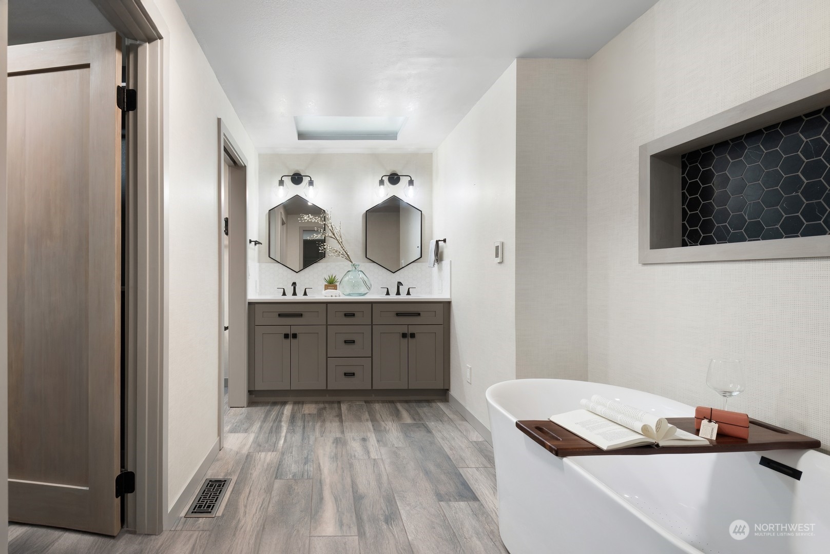 24327 Lockwood Road Bothell, WA 98021 - Photo 21 of 40 a view of a hallway with a dresser and a mirror