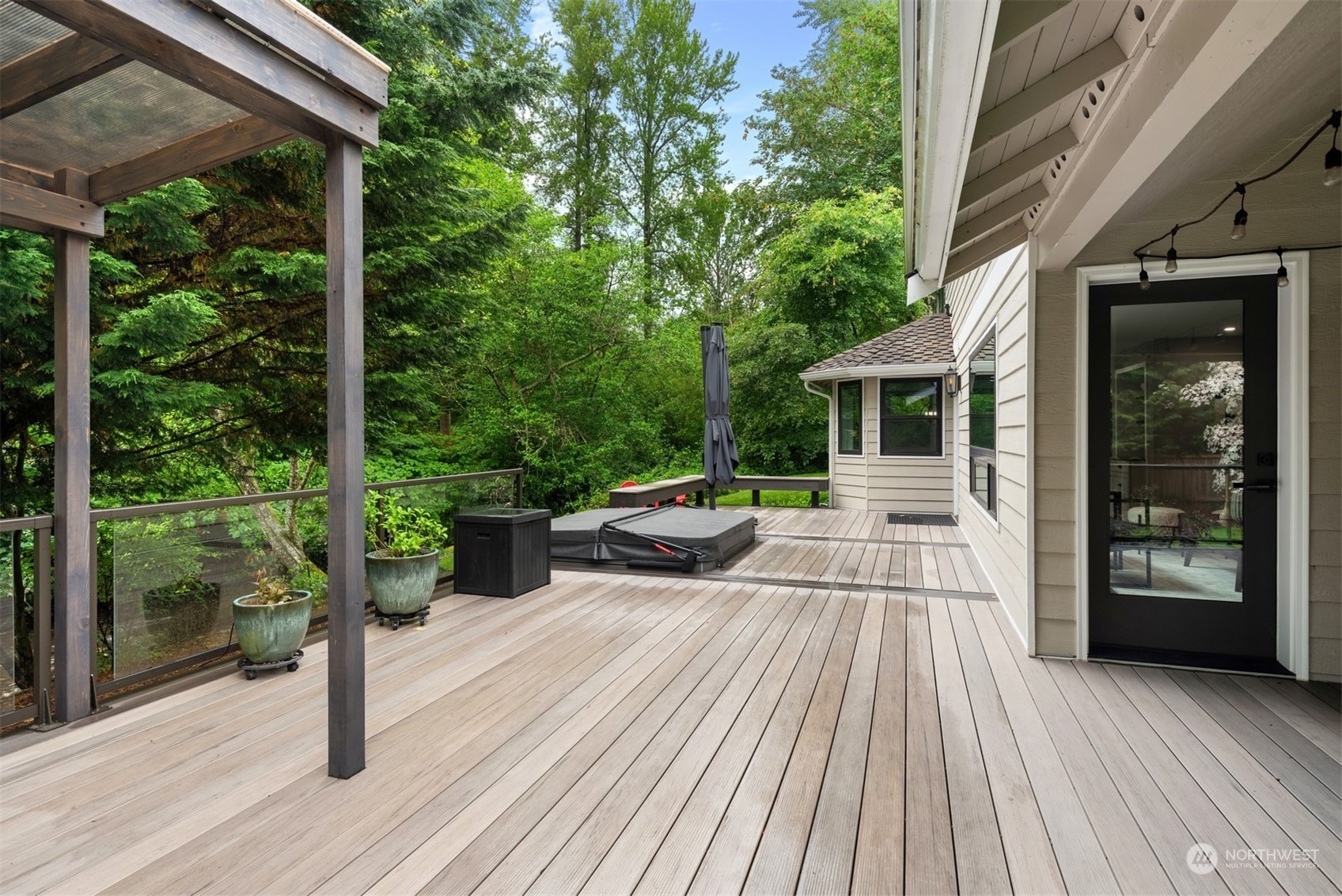 24327 Lockwood Road Bothell, WA 98021 - Photo 29 of 40 a view of a patio with couches table and chairs and wooden floor