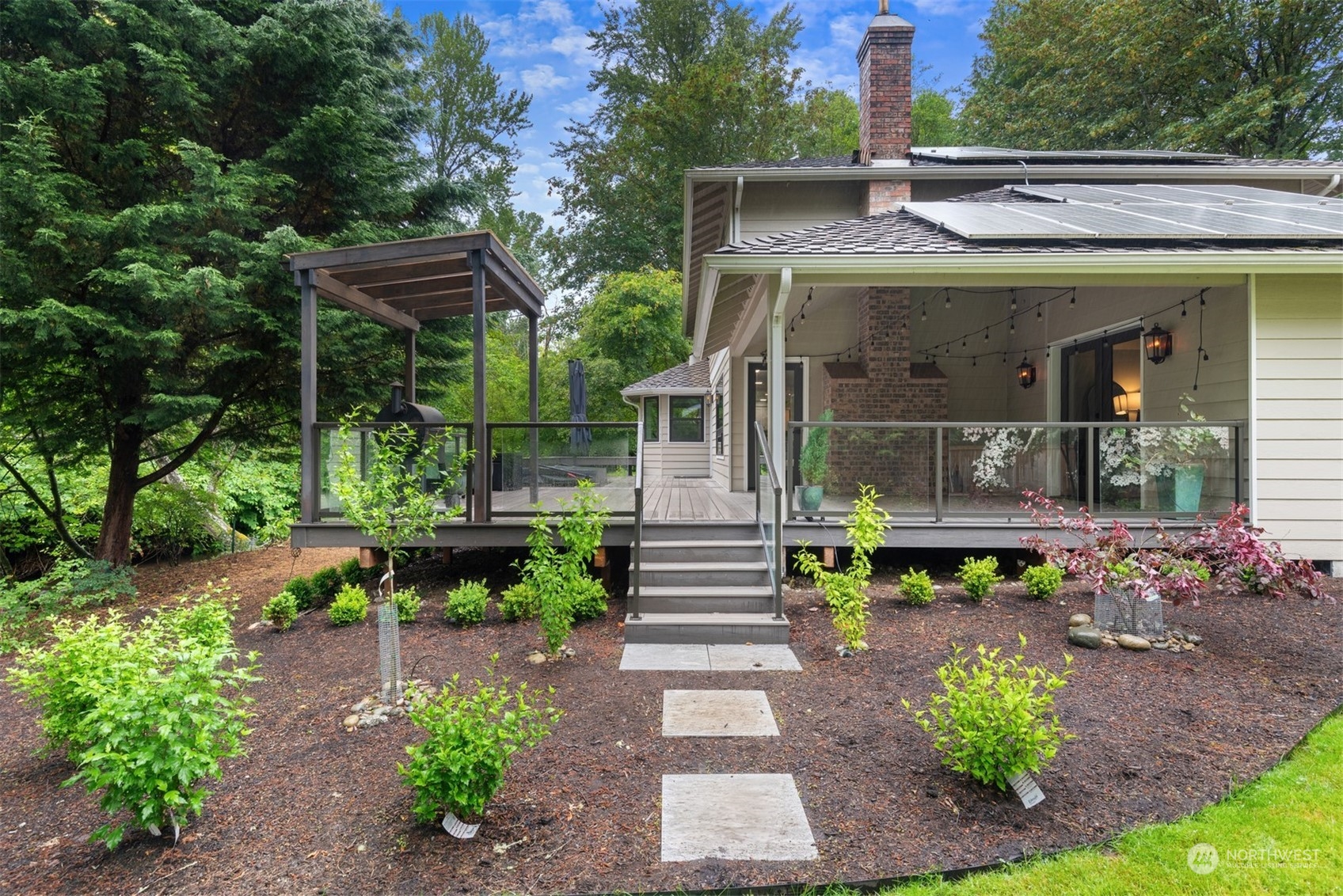 24327 Lockwood Road Bothell, WA 98021 - Photo 31 of 40 a view of a house with sitting area and a garden