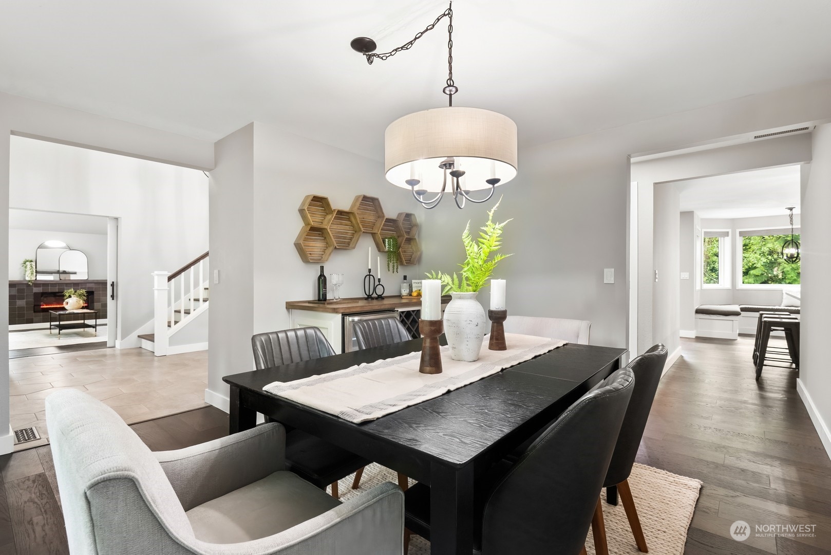 24327 Lockwood Road Bothell, WA 98021 - Photo 7 of 40 a view of a dining room with furniture wooden floor and chandelier