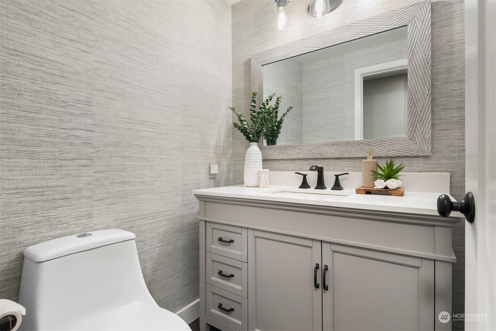 24327 Lockwood Road Bothell, WA 98021 - Photo 8 of 40 a bathroom with a toilet sink and mirror